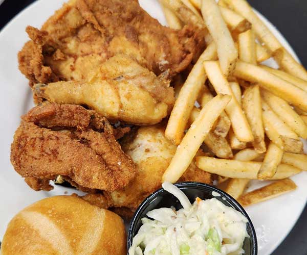 Breaded chicken pressure fried to a golden brown served with coleslaw fries and a roll. Brought to you by Chartroom Food & Spirits in Racine WI.