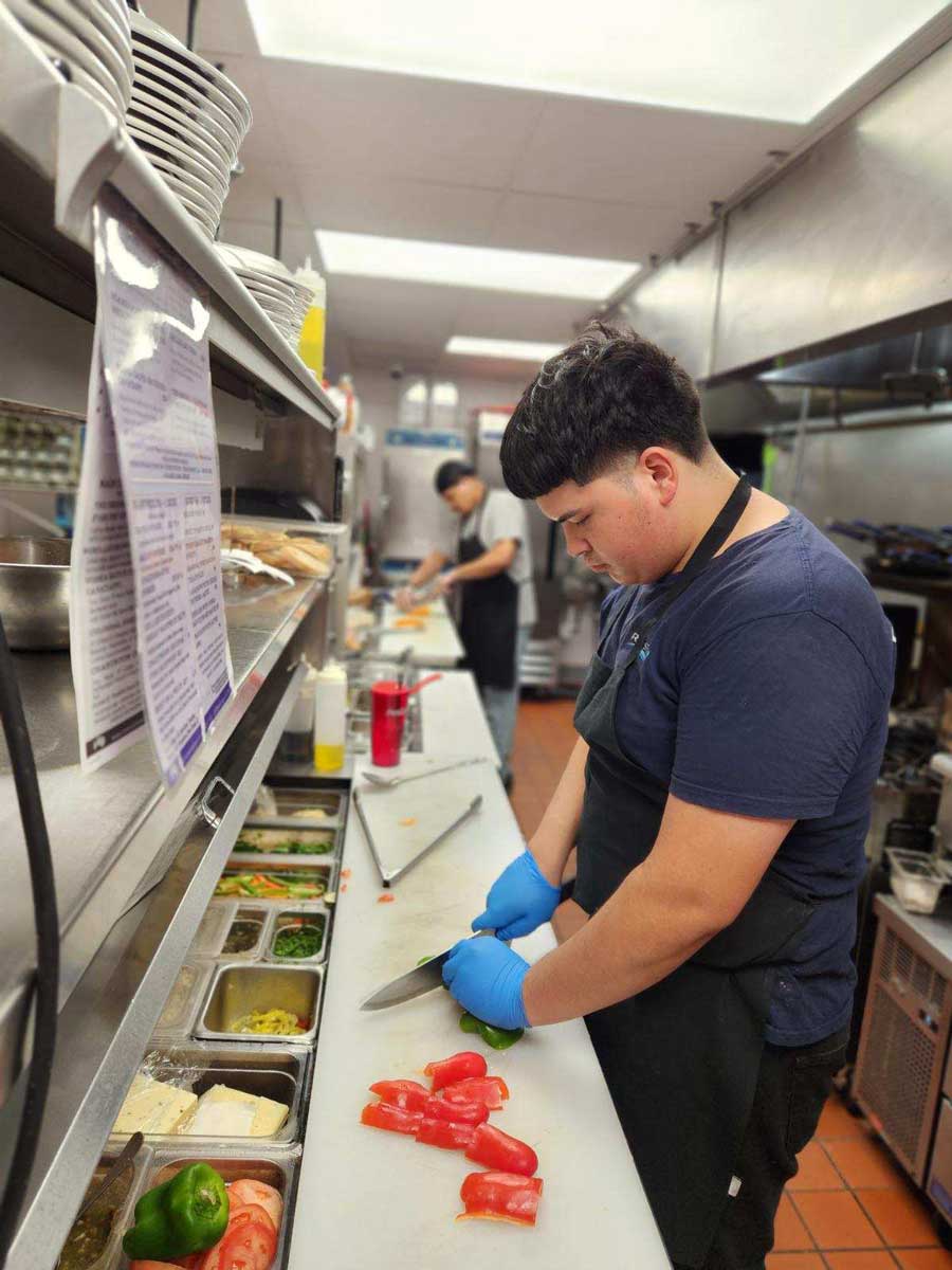 Rivers End Chef prepares food