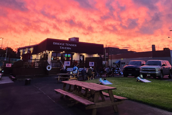 Exterior of Bridge Tender Tavern at Rivers End in Racine Wisconsin at sunset.